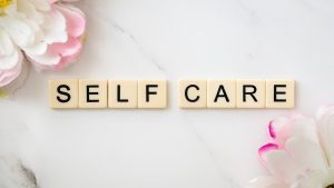 Self Care written out in small tiles